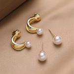 Gold Toned Contemporary Pearls Studs Earrings